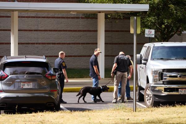 Law enforcement officers outside Perrin Woods Elementary School after it was evacuated following a bomb threat on Friday. 