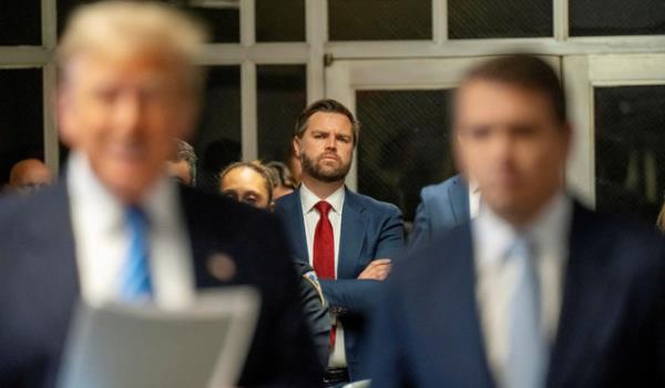 US Senator JD Vance listens to former President Donald Trump address the Pool Press outside the Manhattan Criminal Court room during trial in NYC May 13 2024. (REUTERS)