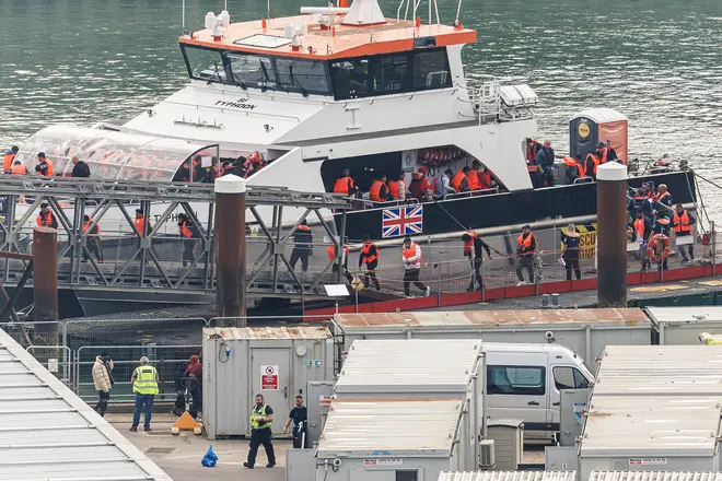 Migrants arrive at Dover Port after being picked up by a Border Force vessel in the English Channel